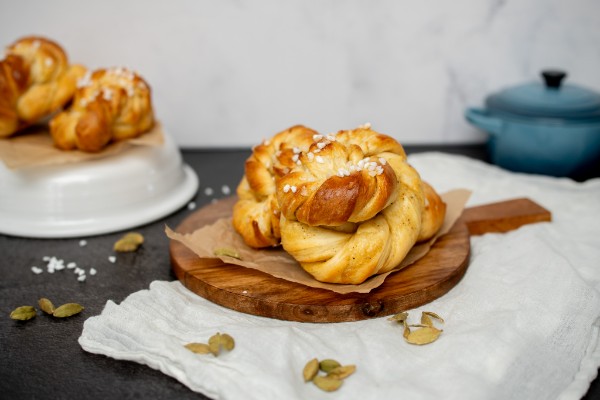 Freshly baked Swedish cardamom buns on cutting board
